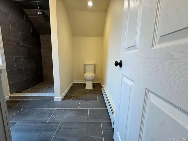 a view of wooden floor and brick walls