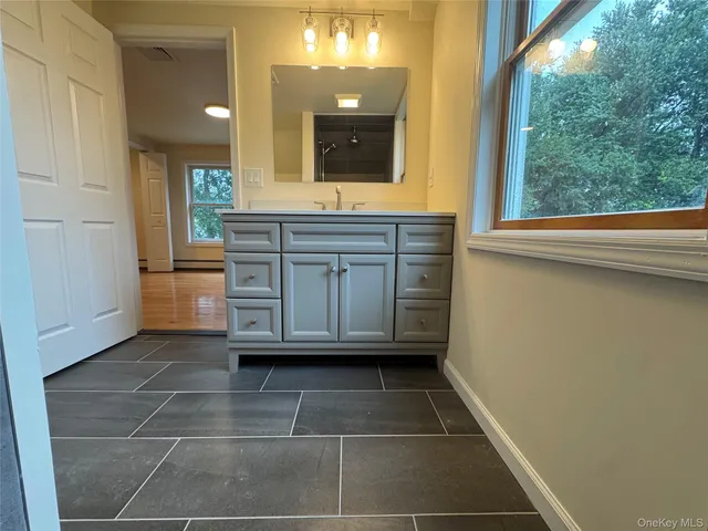 a bathroom with a shower and a toilet