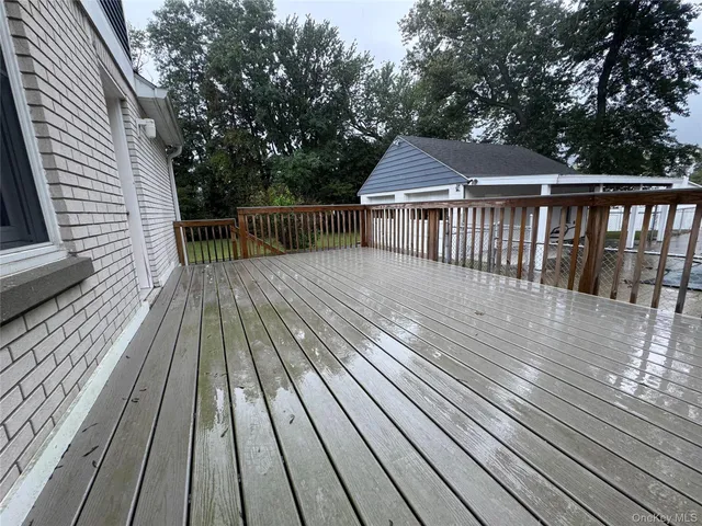 a view of deck with wooden floor and fence