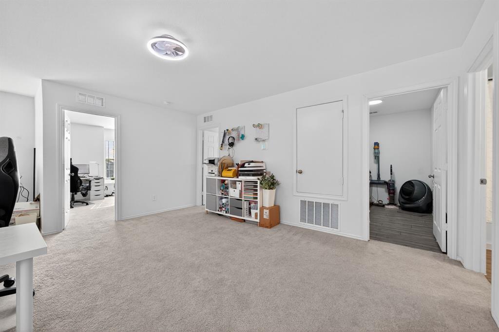 2081 Henrietta Drive Forney, TX 75126 - Photo 20 of 34 a room with furniture and a flat screen tv