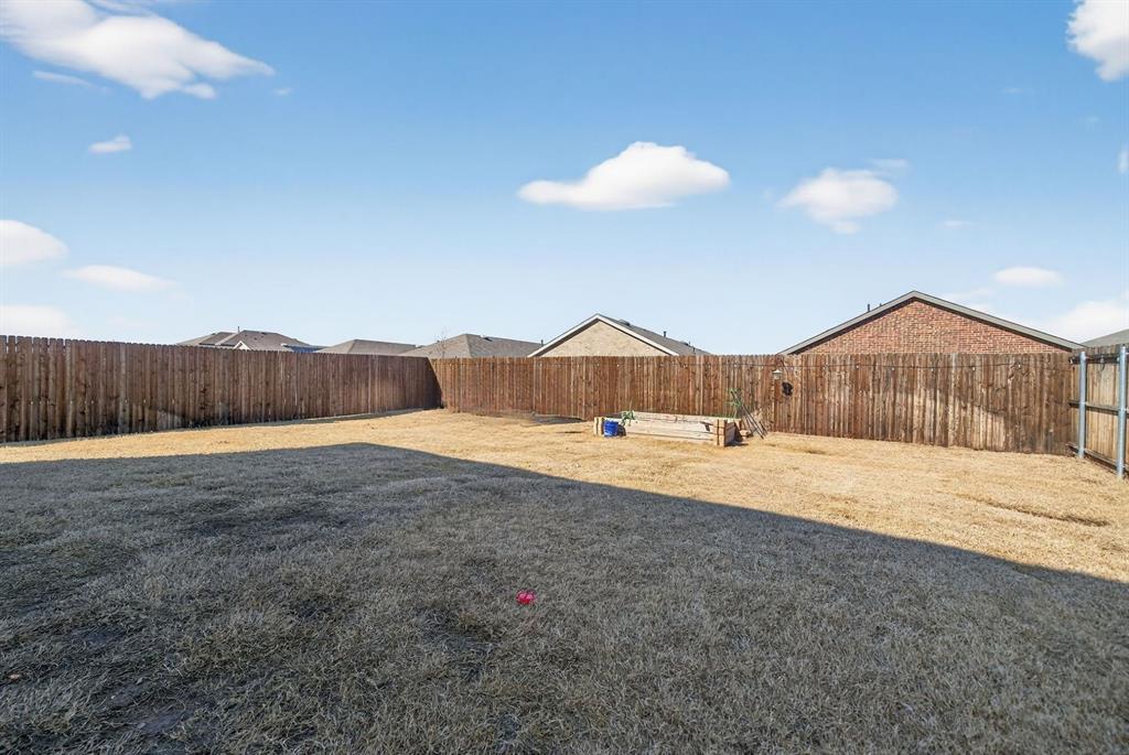 2081 Henrietta Drive Forney, TX 75126 - Photo 33 of 34 a bathroom with a tub and a sink