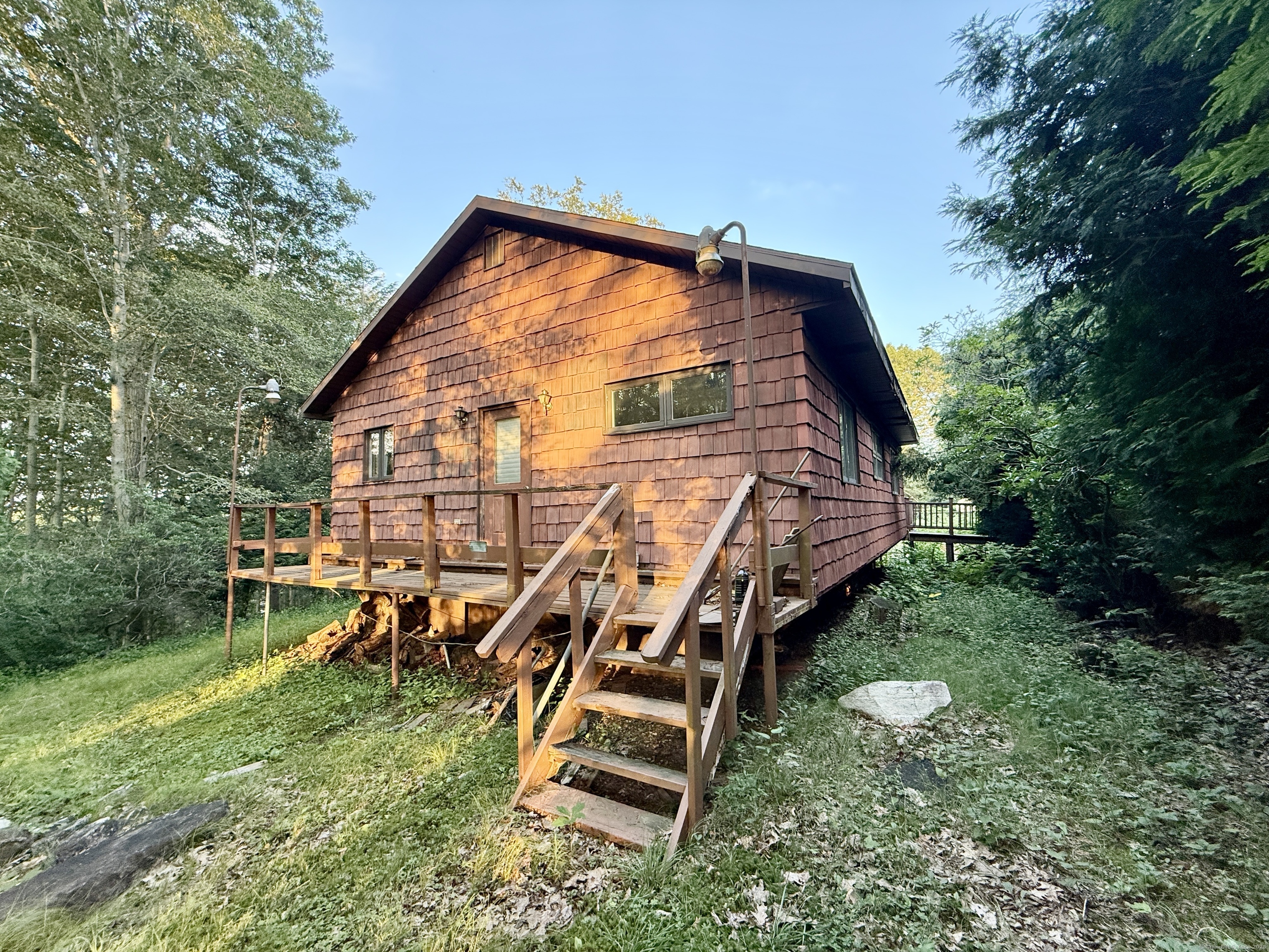 a view of a backyard with sitting area
