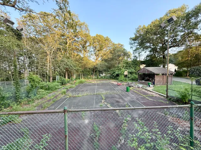 a backyard of a house with lots of green space