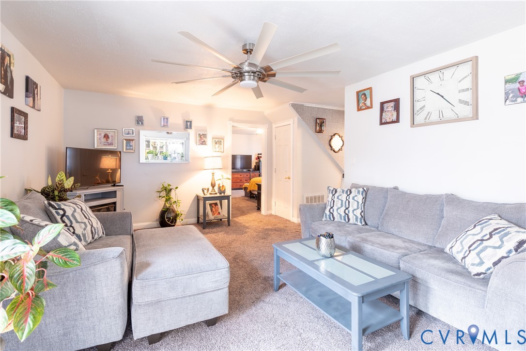 423 Atwater Road Hopewell, VA 23860 - Photo 11 of 14 a living room with furniture a flat screen tv and a window