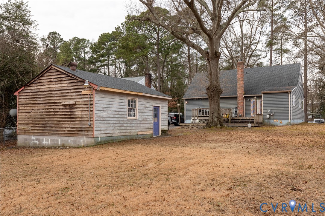 423 Atwater Road Hopewell, VA 23860 - Photo 12 of 14 a view of a house with a yard and garage