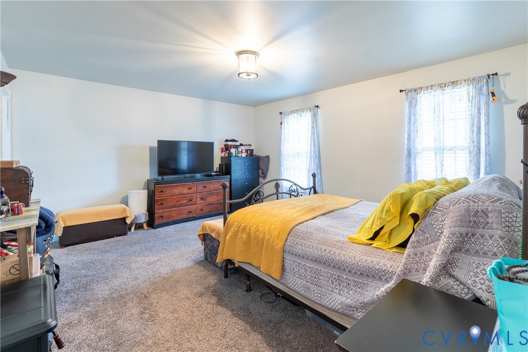 423 Atwater Road Hopewell, VA 23860 - Photo 10 of 14 a bedroom with a bed and a flat screen tv