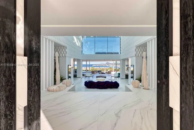 a sitting area with furniture and a potted plant