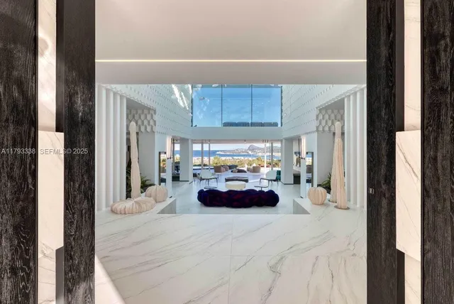 a sitting area with furniture and a potted plant