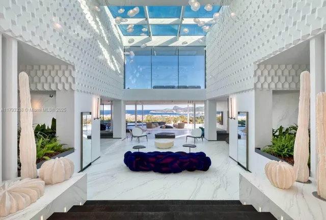 a dining room with furniture a chandelier and wooden floor