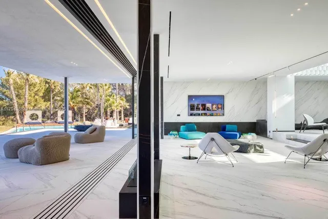 a kitchen with stainless steel appliances granite countertop sink stove dining table and chairs