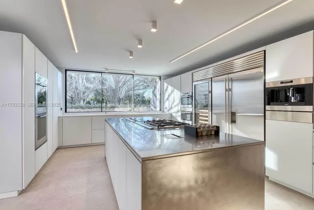 a bathroom with a double vanity sink and mirror