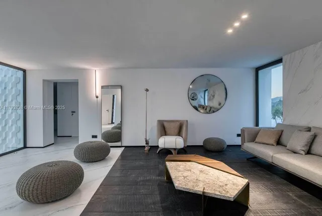 a living room with furniture and a piano