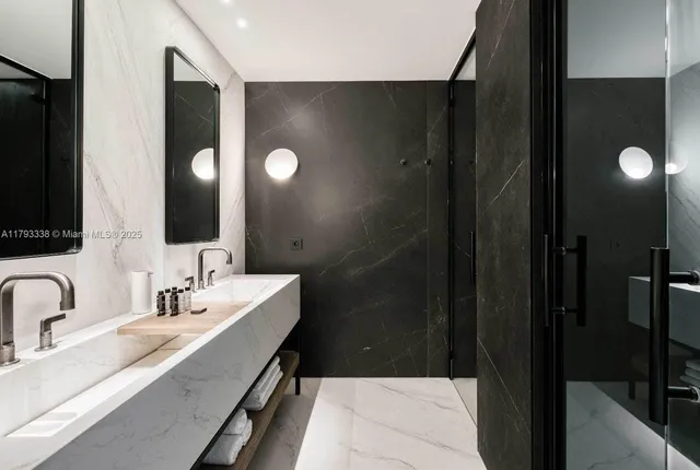 a balcony with furniture and a potted plant