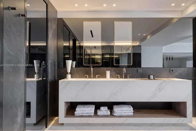 a bathroom with a double vanity sink mirror and double