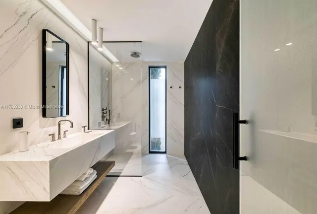 a bed room with a bed and a large window