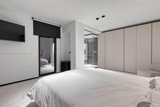 a view of a patio with couches table and chairs with wooden floor and fence