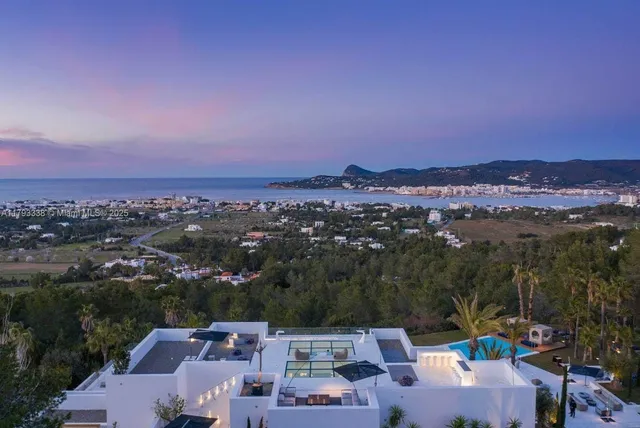 a view of swimming pool with outdoor seating and plants