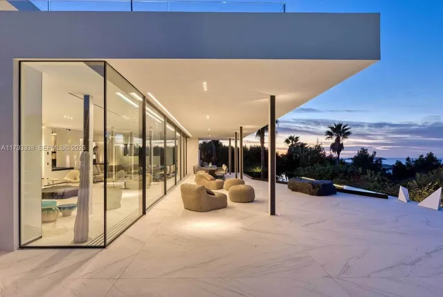 a view of a dining room with furniture wooden floor and chandelier