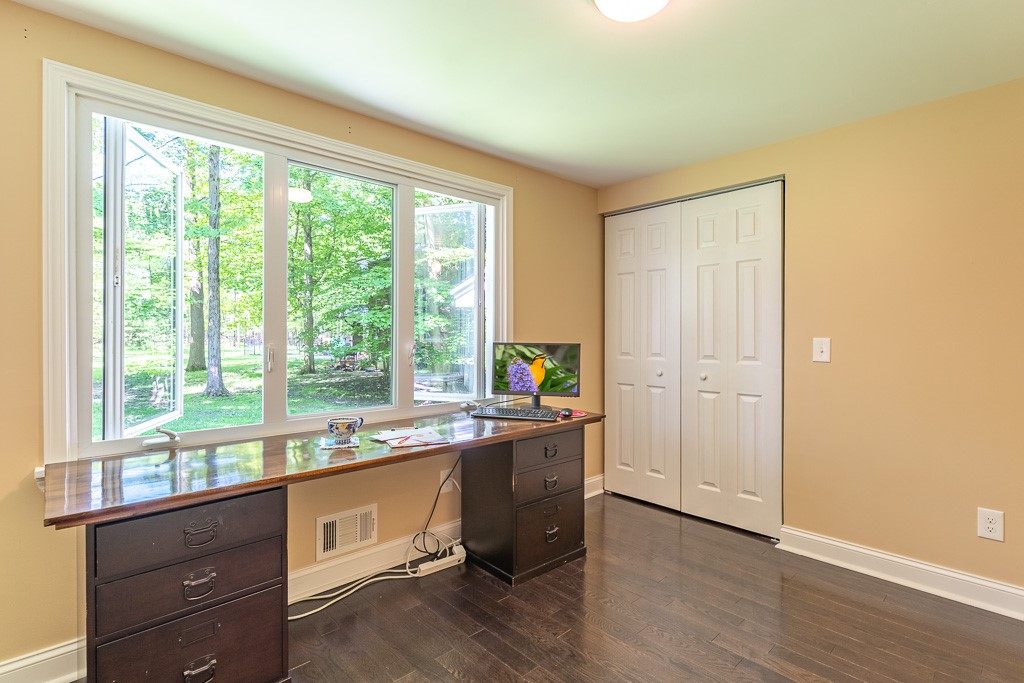 220 Hibiscus Drive Rochester, NY 14618 - Photo 28 of 50 The first floor offers exceptional flexibility, including a bedroom ideal as a private office, guest retreat, or creative studio.