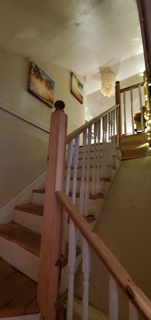 9315 South Clyde Avenue Chicago, IL 60617 - Photo 20 of 32 a view of entryway and hall with wooden floor