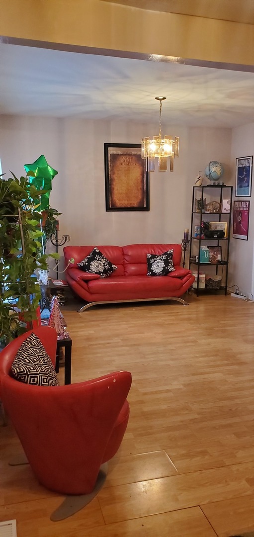 9315 South Clyde Avenue Chicago, IL 60617 - Photo 3 of 32 a room with lots of different colored cloths