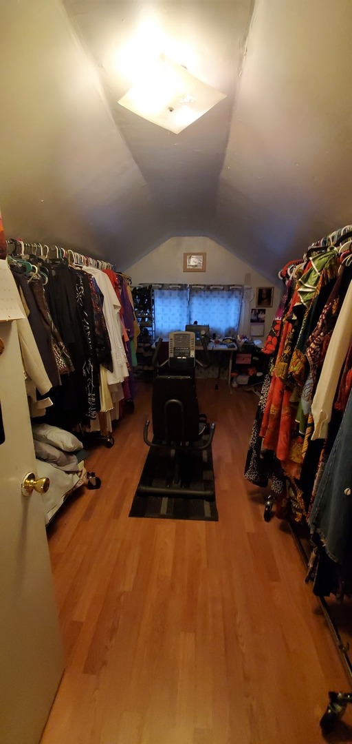 9315 South Clyde Avenue Chicago, IL 60617 - Photo 22 of 32 a room with gym equipment and a view of living room