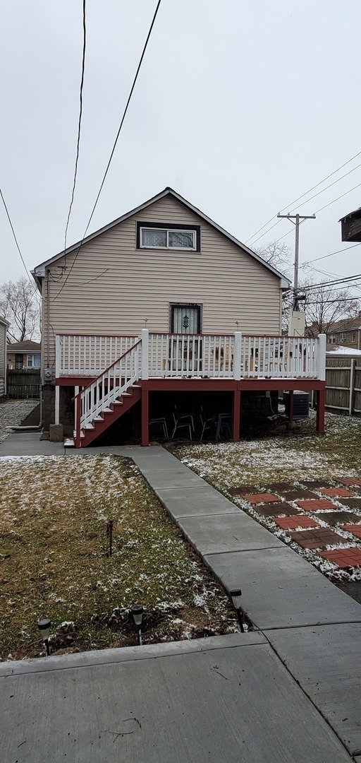 9315 South Clyde Avenue Chicago, IL 60617 - Photo 28 of 32 a house view with a backyard space