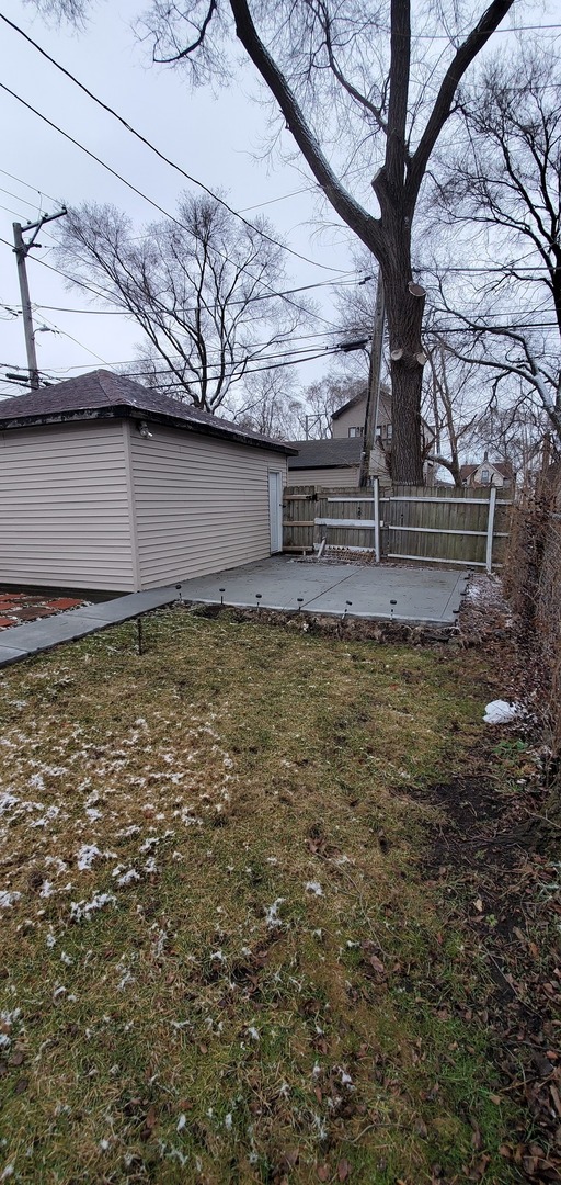 9315 South Clyde Avenue Chicago, IL 60617 - Photo 30 of 32 a view of a yard with large tree