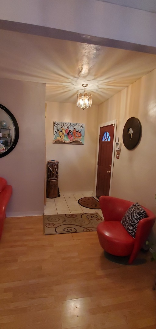 9315 South Clyde Avenue Chicago, IL 60617 - Photo 5 of 32 a bathroom with a sink and a mirror