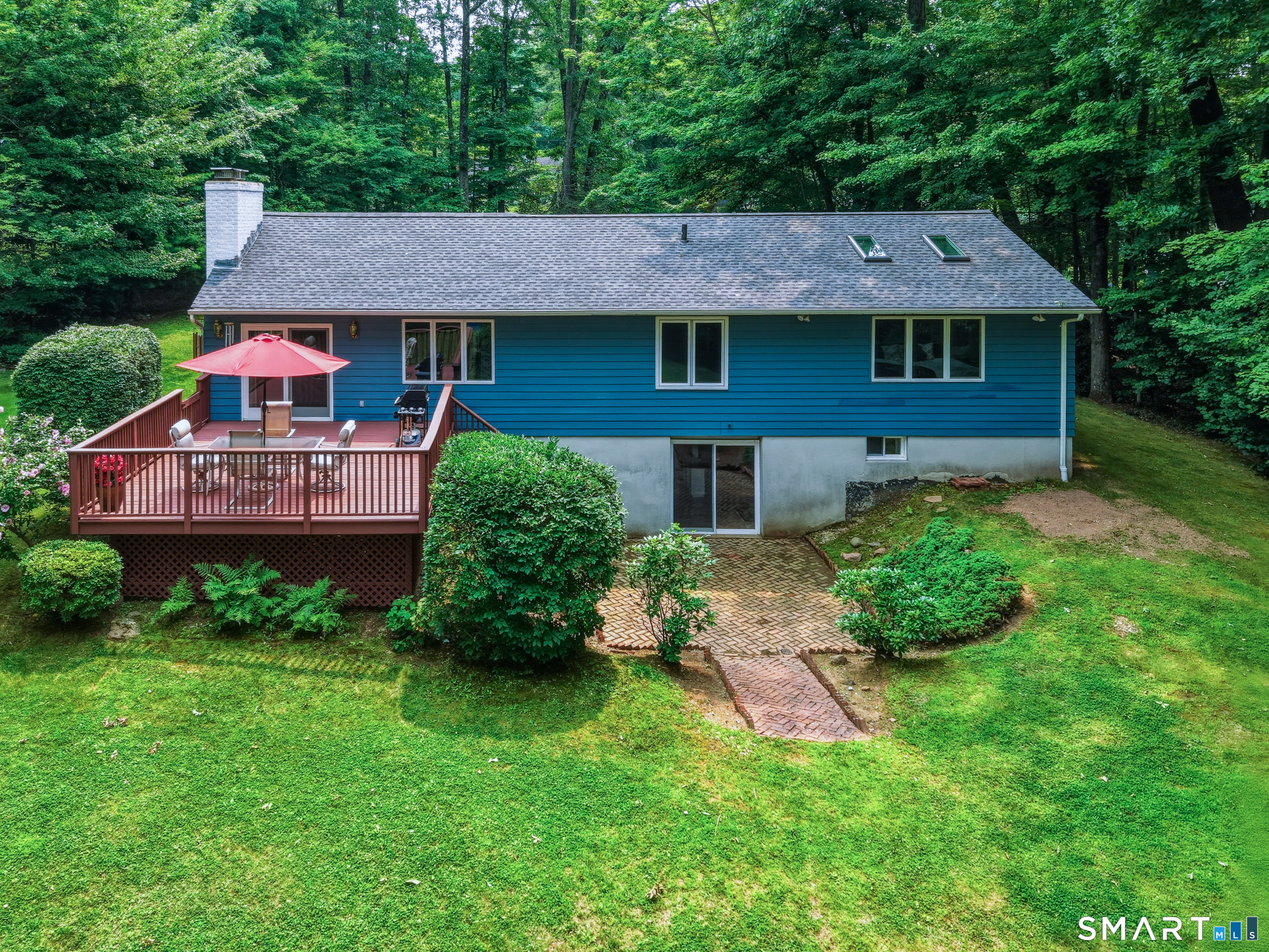 30 Grant Hill Road Bloomfield, CT 06002 - Photo 36 of 40 Rear elevation showing walk out with deck and patio