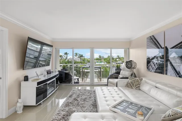 a large white kitchen with lots of counter space dining table and chairs