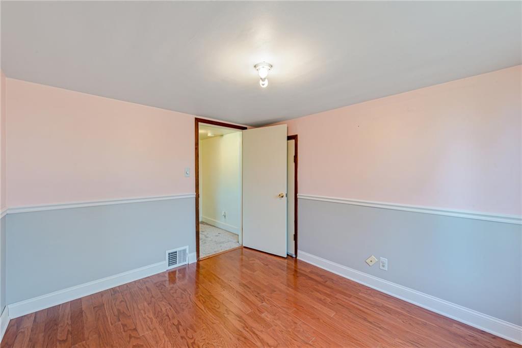 456 Chicora Road Butler, PA 16001 - Photo 17 of 36 an empty room with wooden floor closet and windows