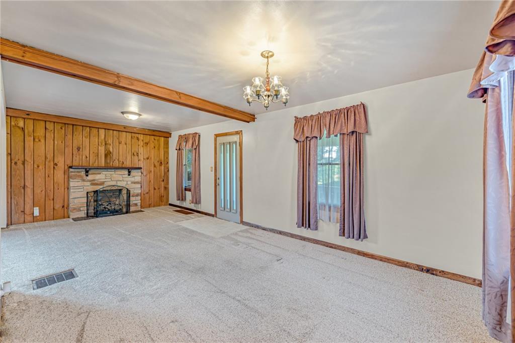 456 Chicora Road Butler, PA 16001 - Photo 3 of 36 a view of a livingroom with a fireplace a chandelier and couch