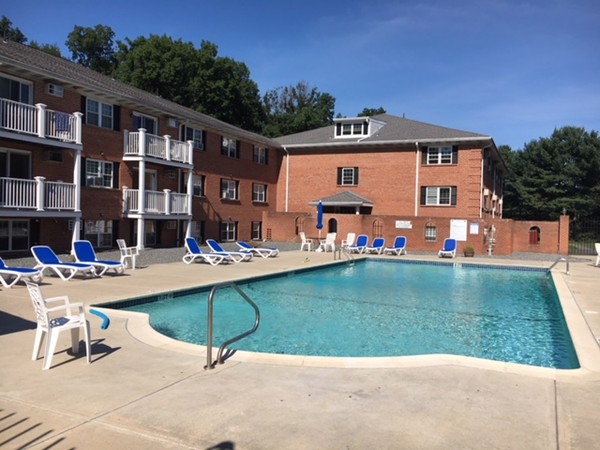 80 Leonard Road, Unit 80 Boxborough, MA 01719 - Photo 1 of 6 a view of a house with a swimming pool