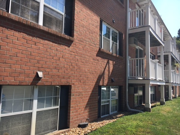 80 Leonard Road, Unit 80 Boxborough, MA 01719 - Photo 5 of 6 a brick building with a large windows