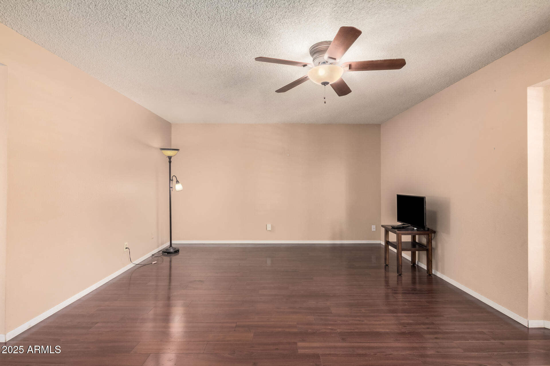 4321 West Greenway Road Glendale, AZ 85306 - Photo 16 of 39 a view of a room with wooden floor fan and window