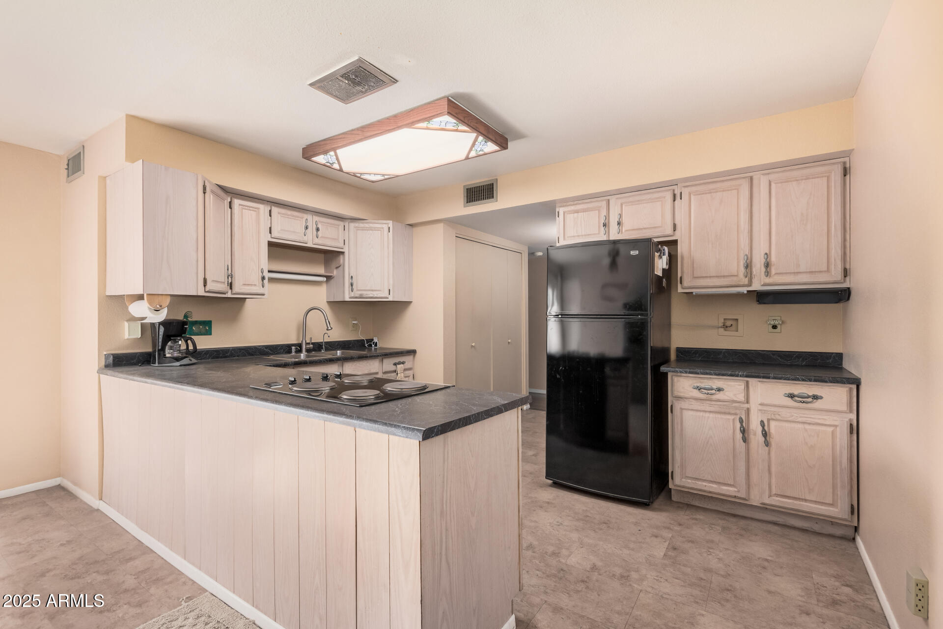4321 West Greenway Road Glendale, AZ 85306 - Photo 21 of 39 a kitchen with stainless steel appliances granite countertop a refrigerator stove and sink
