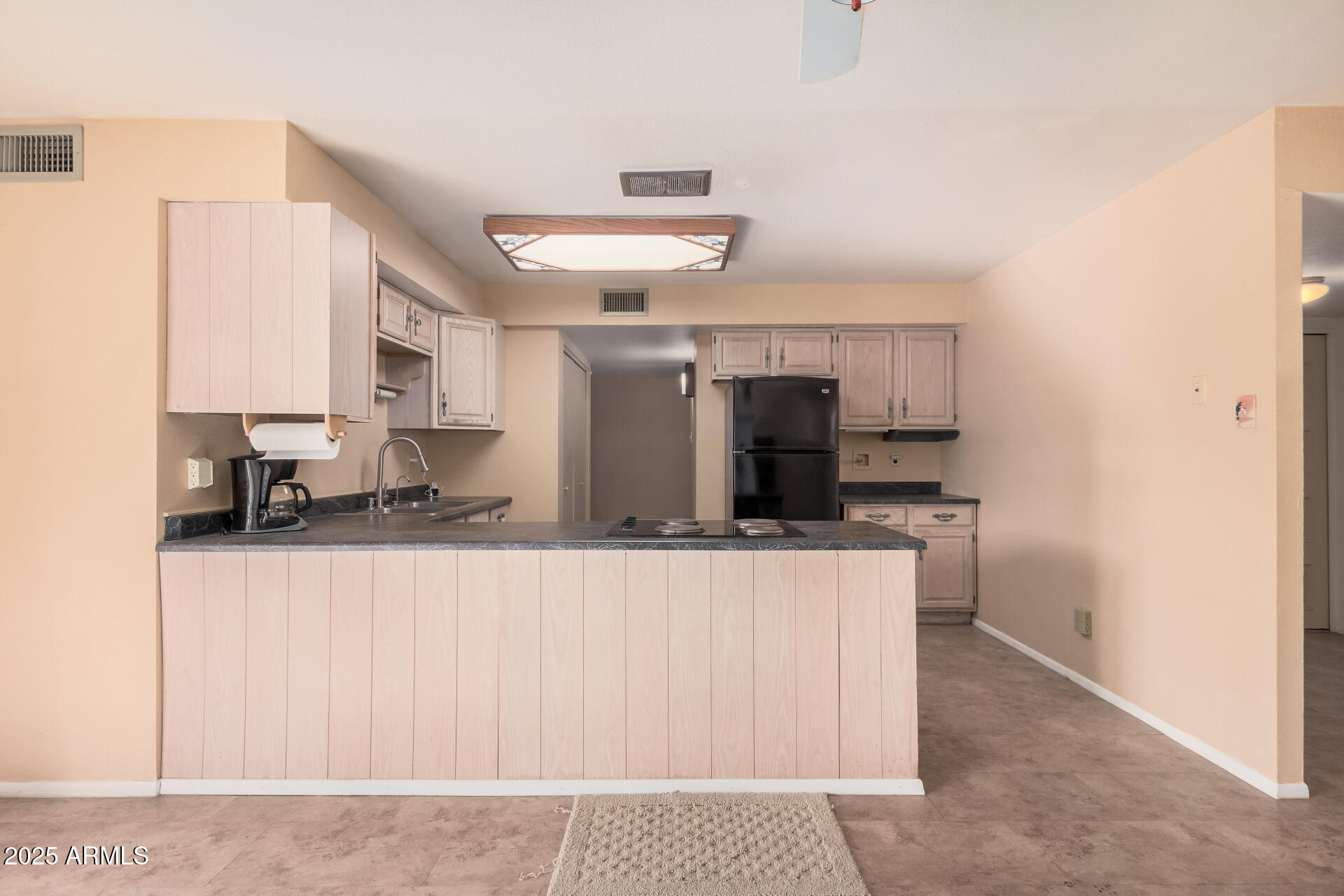 4321 West Greenway Road Glendale, AZ 85306 - Photo 23 of 39 a kitchen with stainless steel appliances a sink a stove and a refrigerator