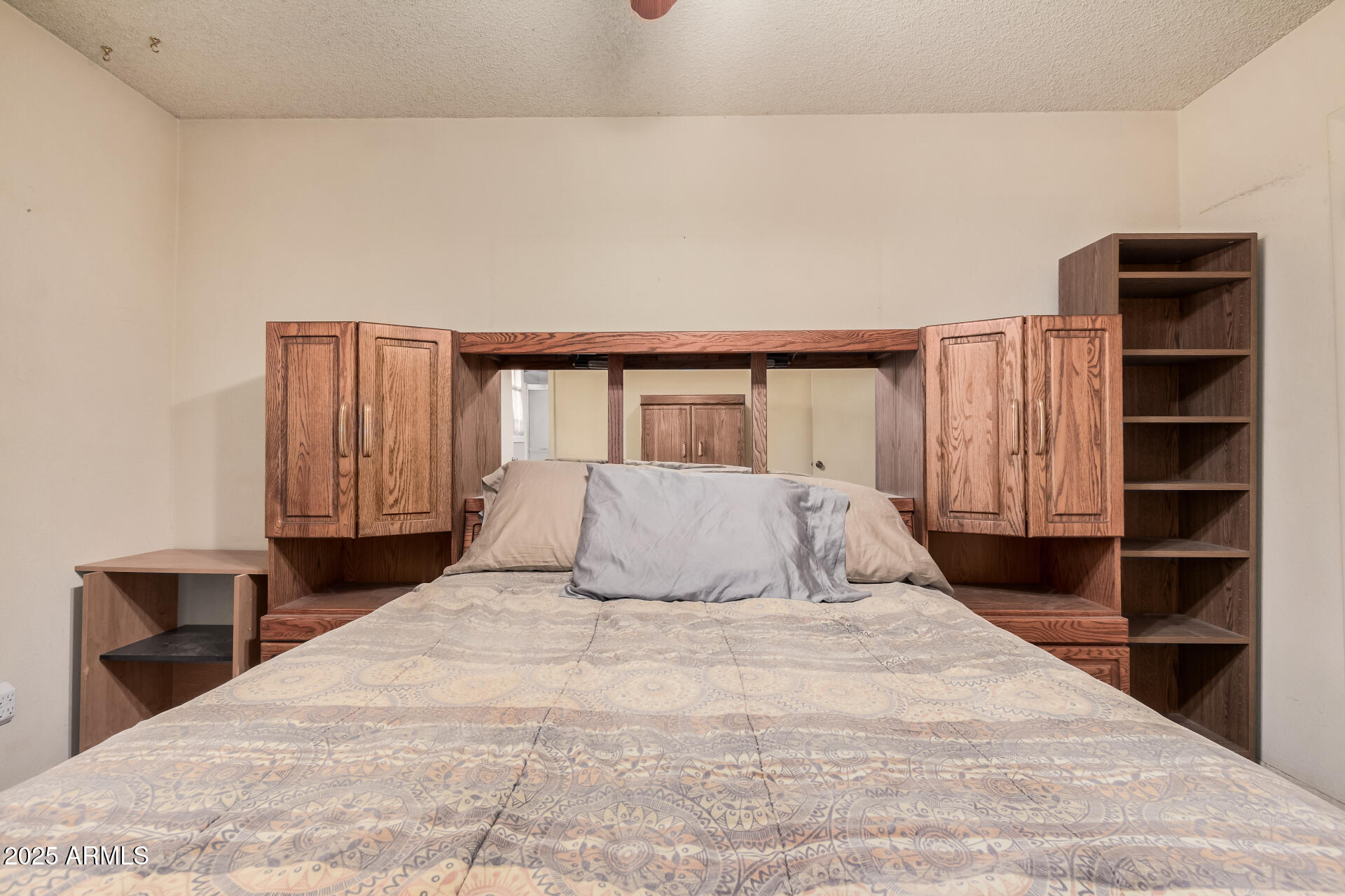 4321 West Greenway Road Glendale, AZ 85306 - Photo 26 of 39 a bedroom with a large bed and a closet
