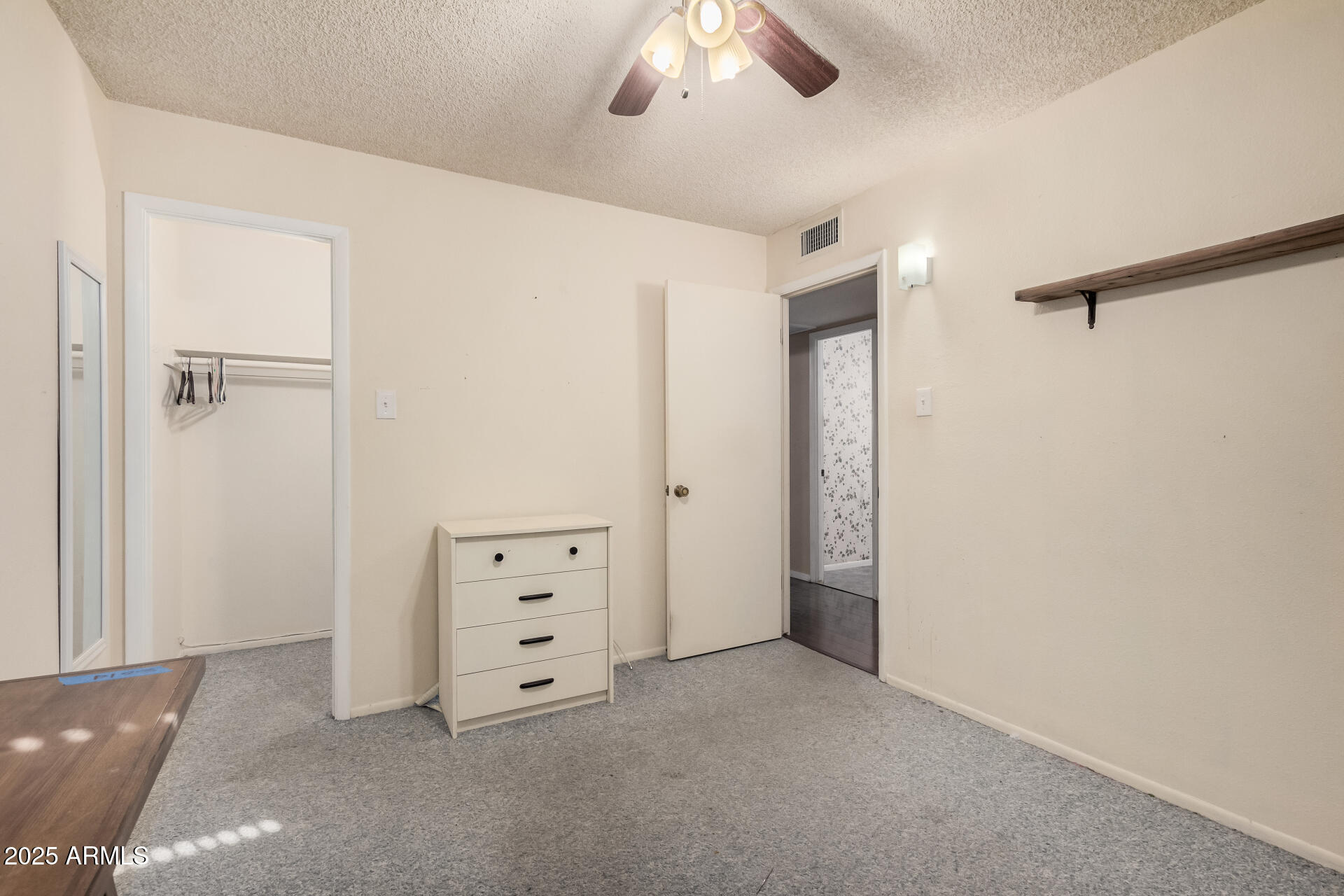 4321 West Greenway Road Glendale, AZ 85306 - Photo 31 of 39 a view of an empty room with cabinet and window