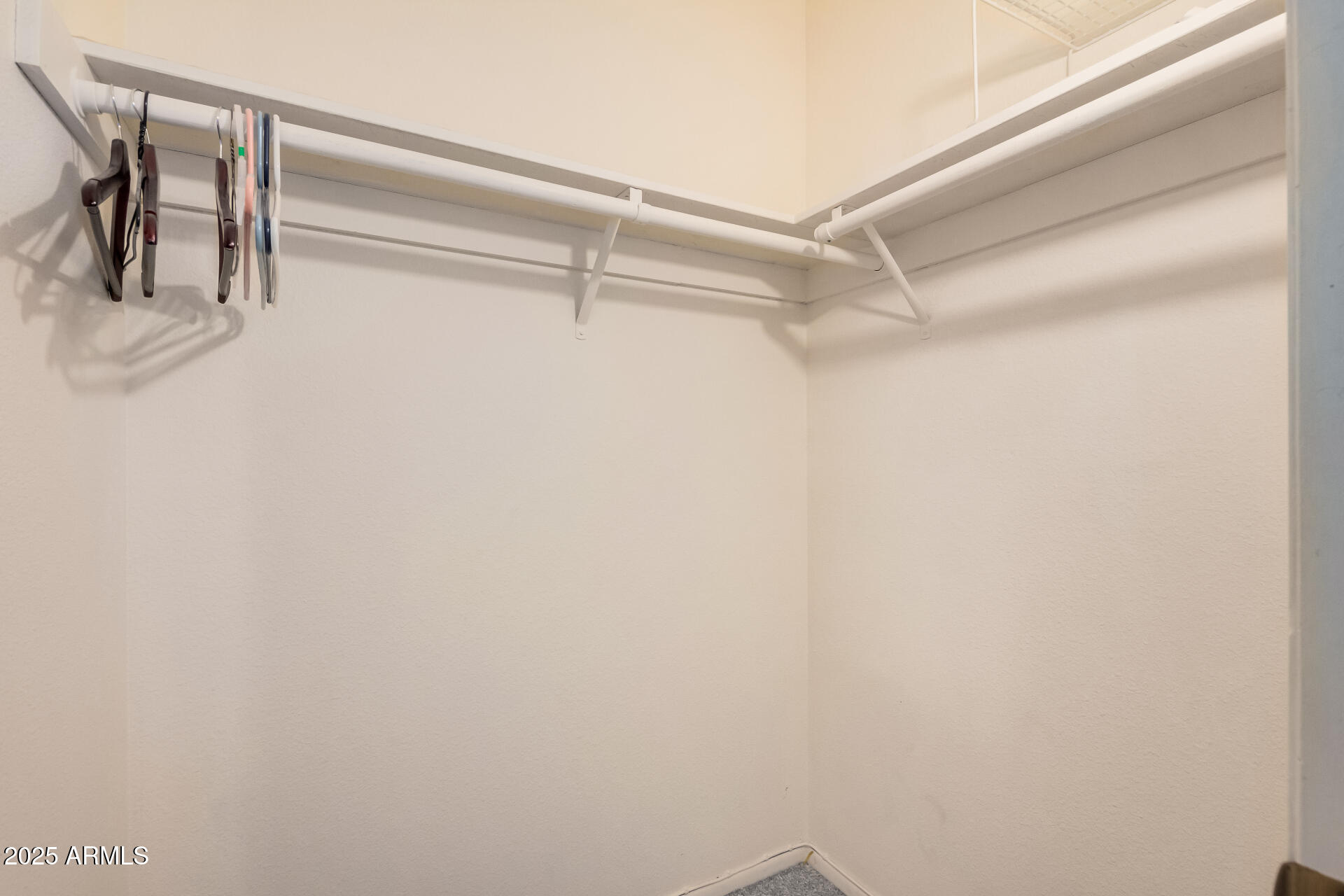 4321 West Greenway Road Glendale, AZ 85306 - Photo 32 of 39 a view of a room with rack on the wall