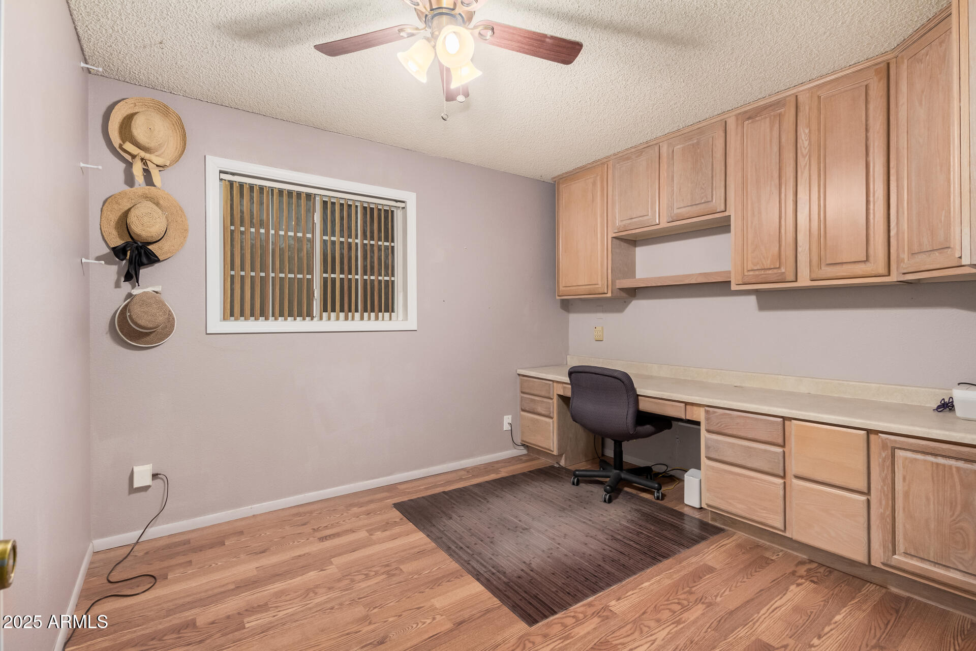 4321 West Greenway Road Glendale, AZ 85306 - Photo 33 of 39 a view of a workspace with furniture and a window