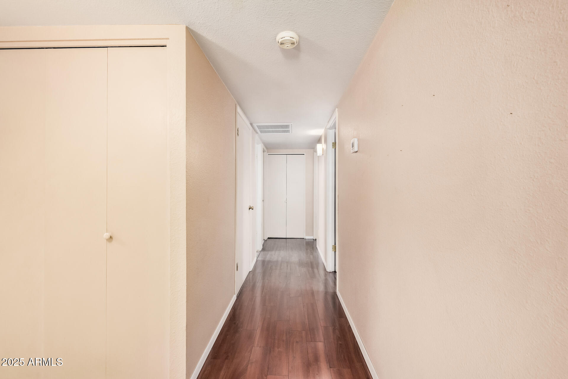 4321 West Greenway Road Glendale, AZ 85306 - Photo 36 of 39 a view of a hallway with wooden floor