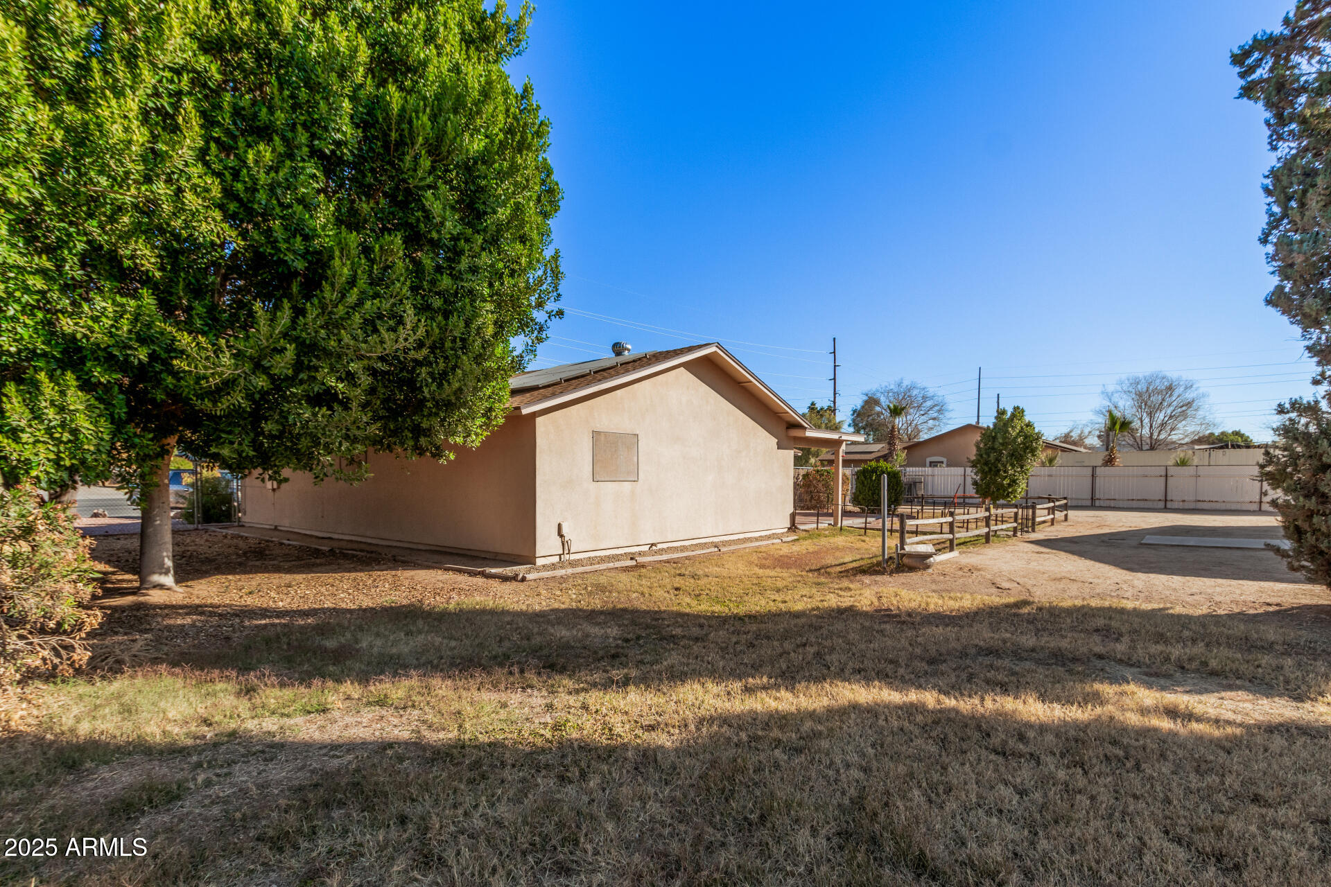 4321 West Greenway Road Glendale, AZ 85306 - Photo 4 of 39 a view of a house with a yard and large tree