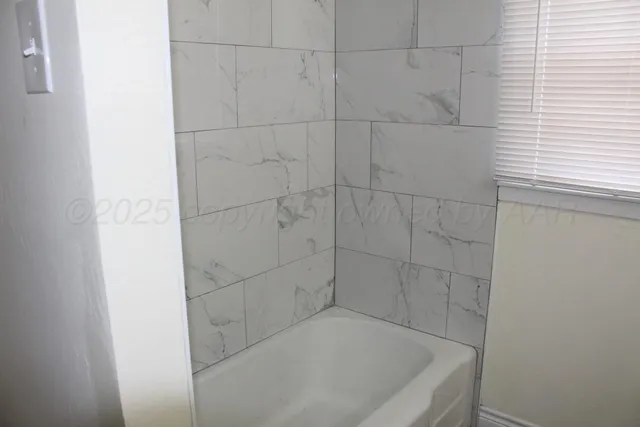 a bathroom with a bathtub