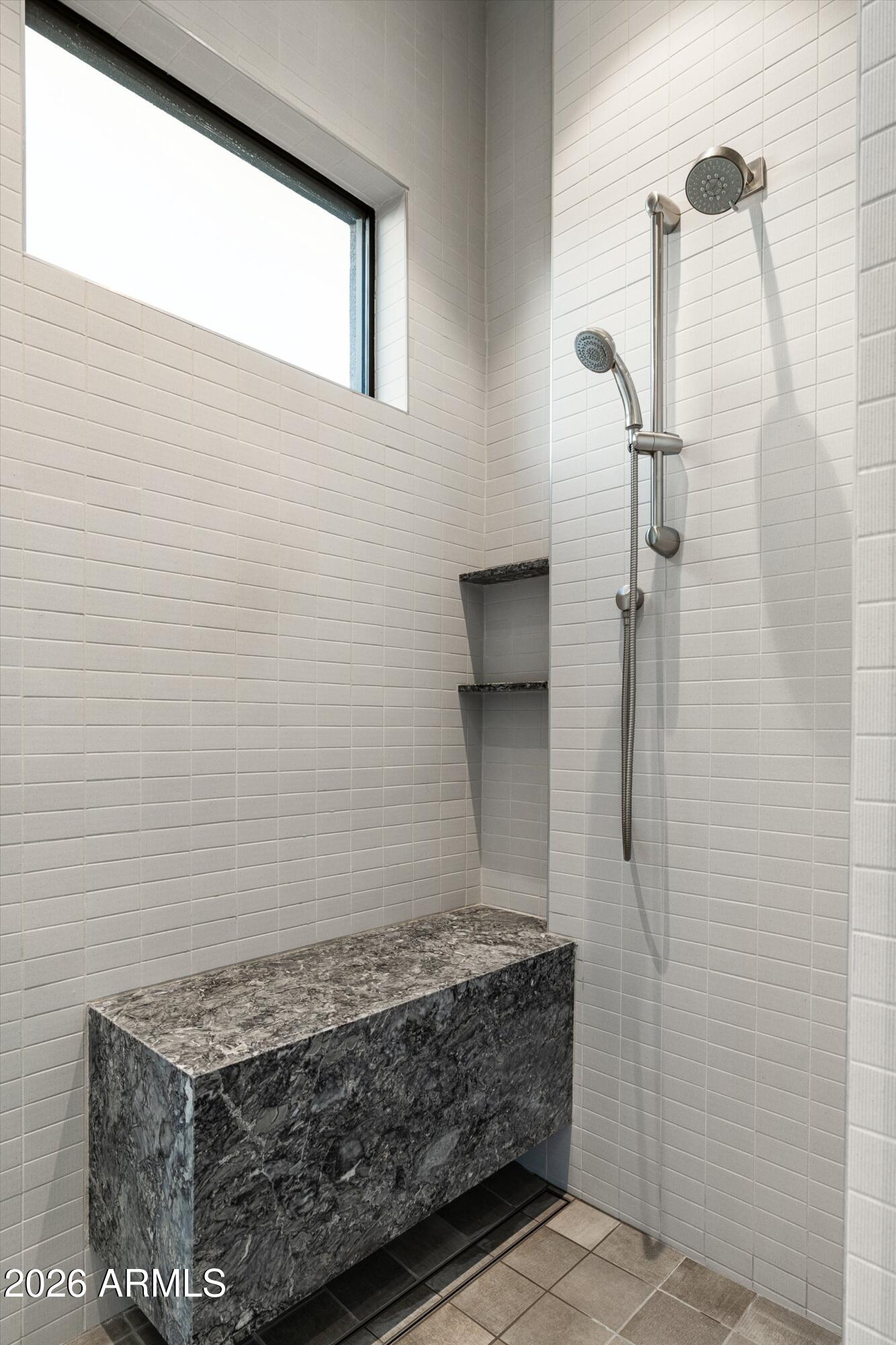 6917 East Cactus Wren Road Paradise Valley, AZ 85253 - Photo 16 of 39 a bathroom with a granite countertop shower a mirror and a sink