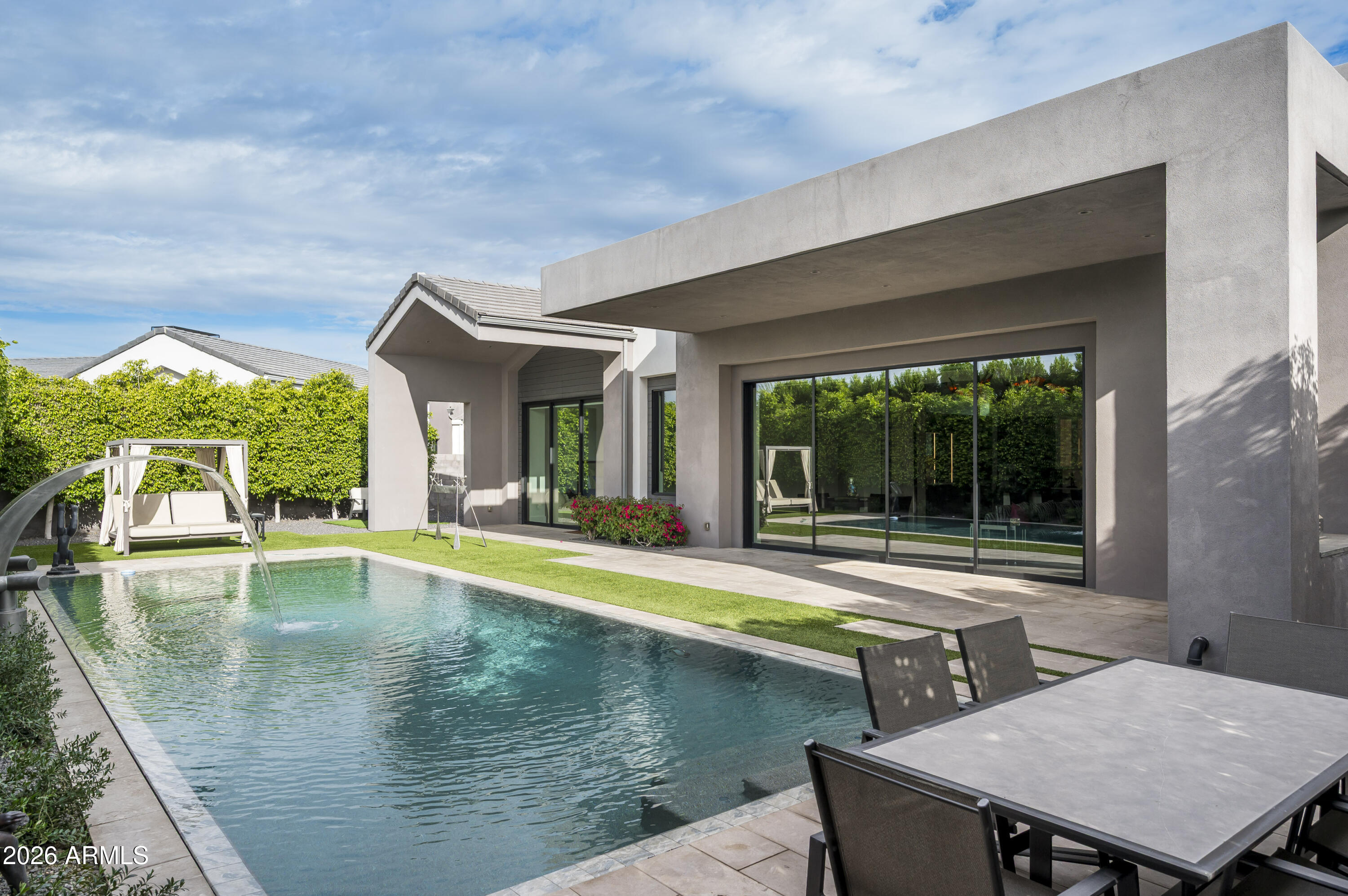 6917 East Cactus Wren Road Paradise Valley, AZ 85253 - Photo 25 of 39 swimming pool view with a seating space