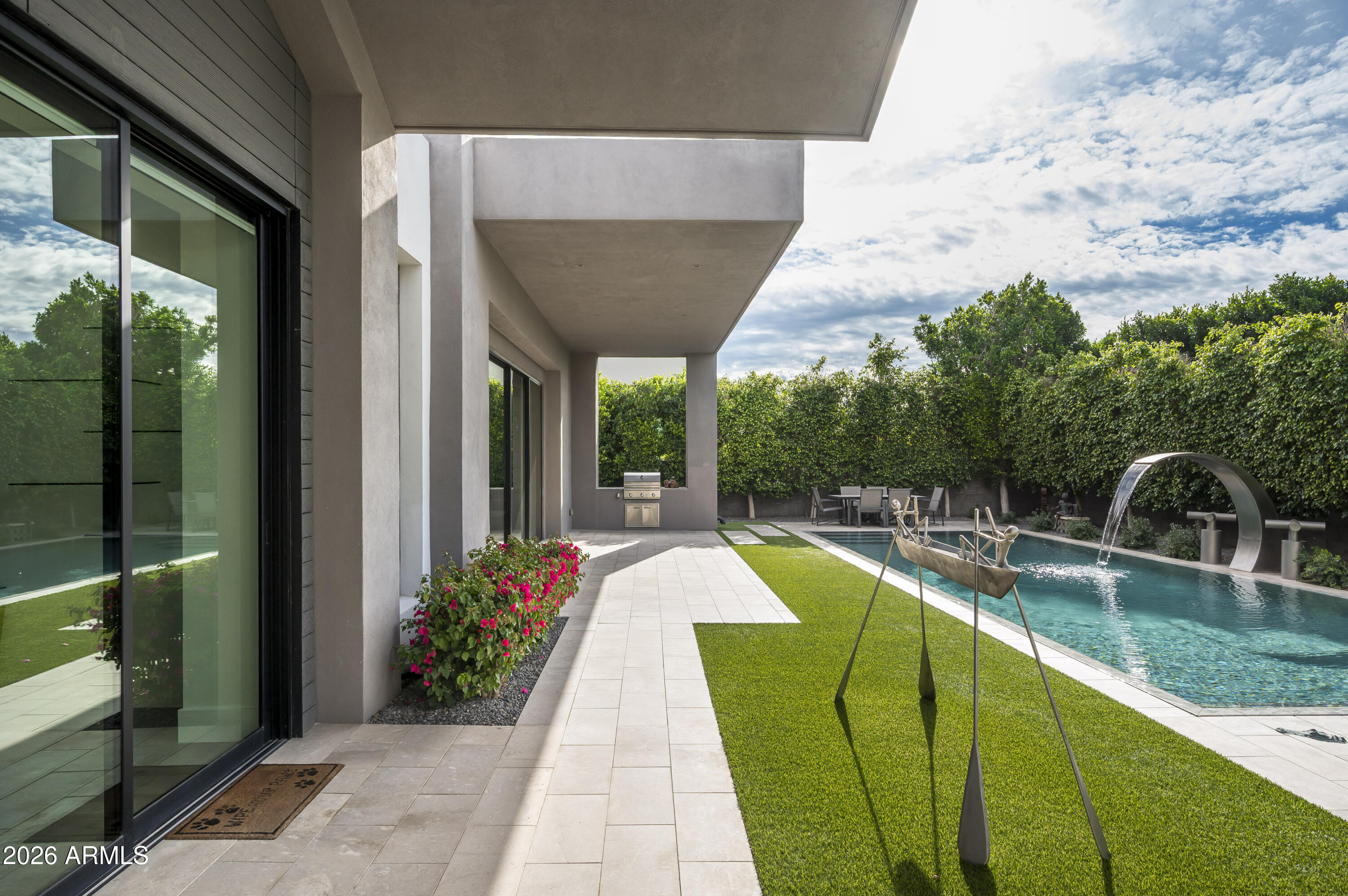 6917 East Cactus Wren Road Paradise Valley, AZ 85253 - Photo 27 of 39 a view of a swimming pool with a patio