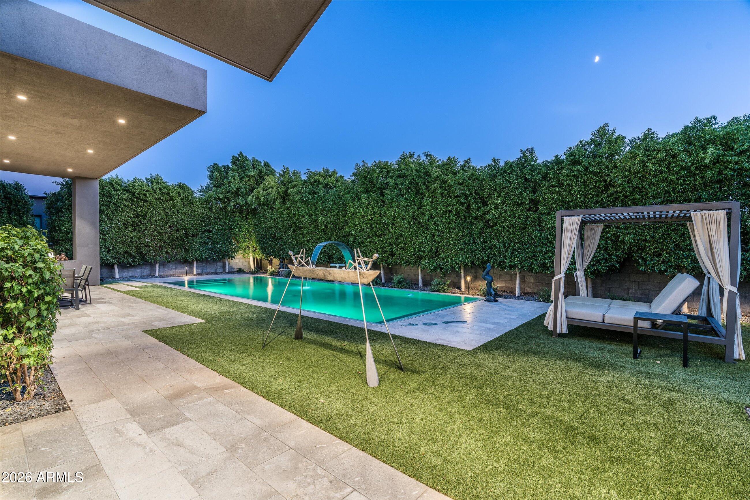 6917 East Cactus Wren Road Paradise Valley, AZ 85253 - Photo 34 of 39 a view of a backyard with sitting area