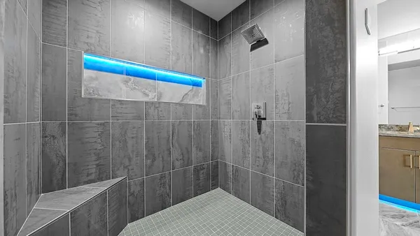 a bathroom with a bathtub and shower
